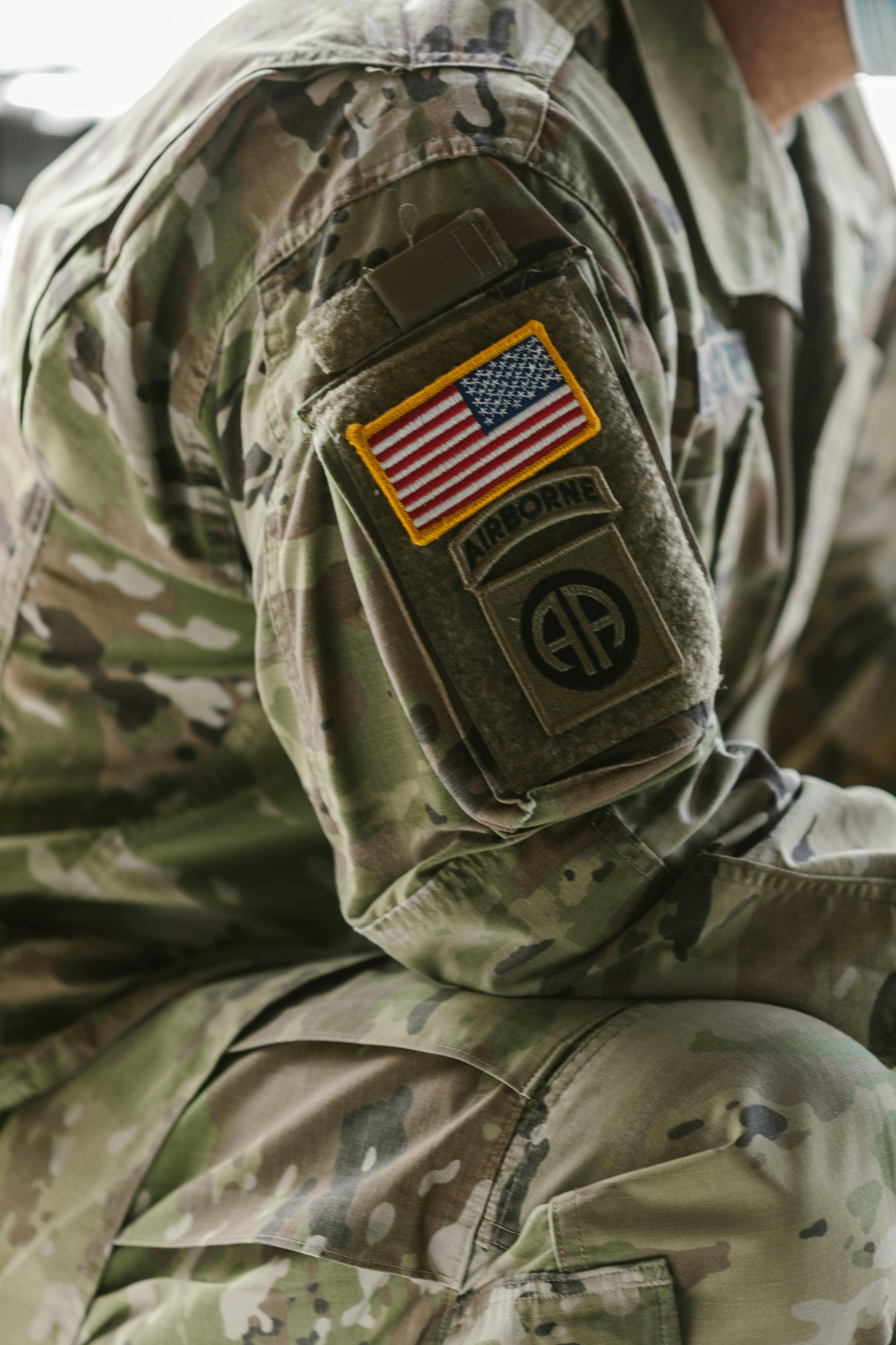 MCN can assist with PTSD close up of american flag patch on veterans arm